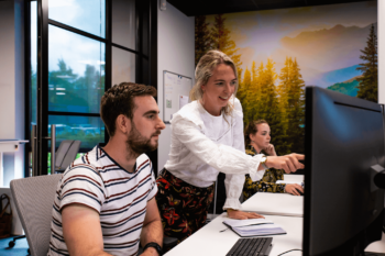 Project management employees discussing an av production.