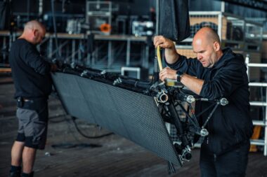 Technicians install the LED screens