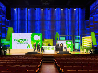 Commerce Week conference stage with LED screen